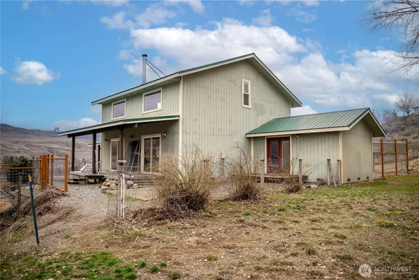 a front view of a house with yard
