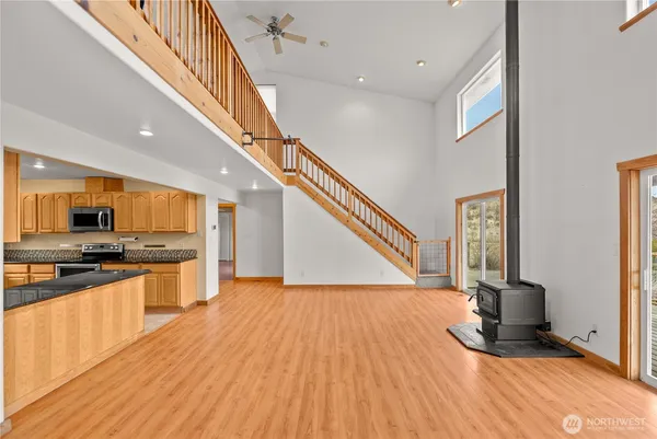 a view of kitchen with sink and microwave