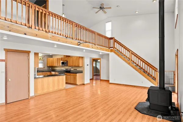 a kitchen with stainless steel appliances granite countertop a refrigerator and a stove