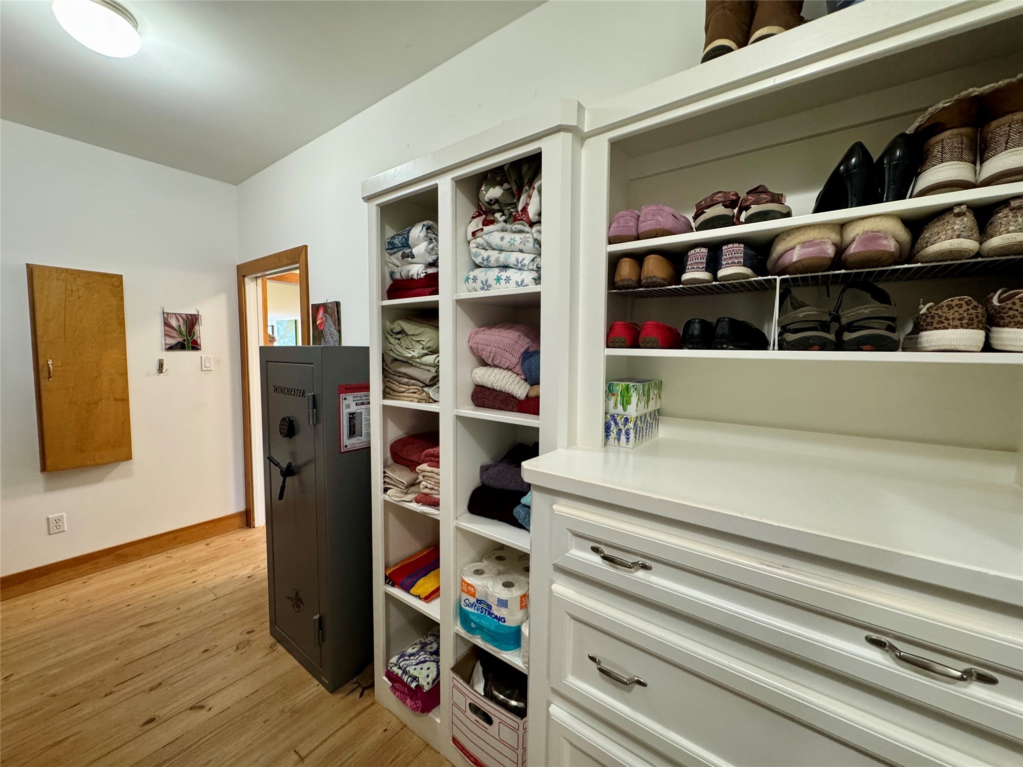 55 Lake Road Huntsville, TX 77320 - Photo 21 of 50 a view of walk in closet with clothes and shoes