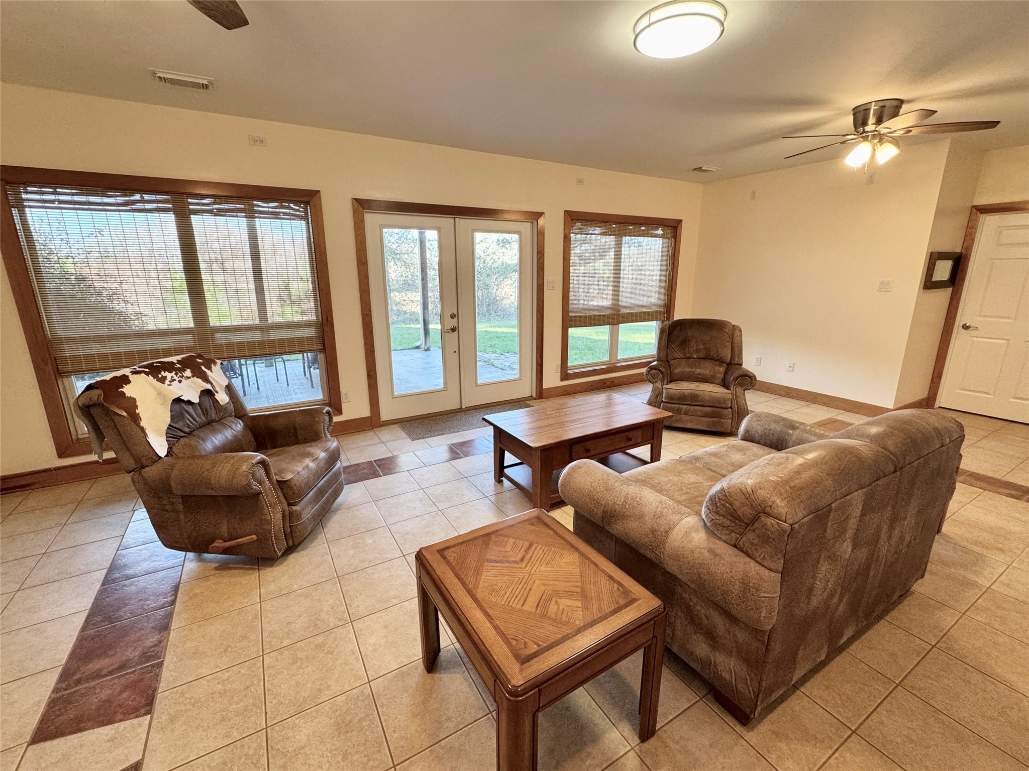 55 Lake Road Huntsville, TX 77320 - Photo 34 of 50 a living room with furniture and a floor to ceiling window