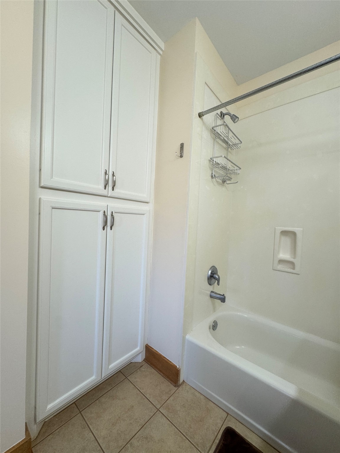 55 Lake Road Huntsville, TX 77320 - Photo 40 of 50 a bathroom with a bathtub and a shower