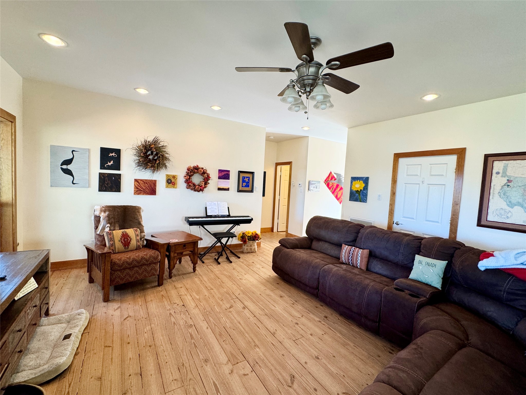 55 Lake Road Huntsville, TX 77320 - Photo 6 of 50 a living room with furniture and a wooden floor