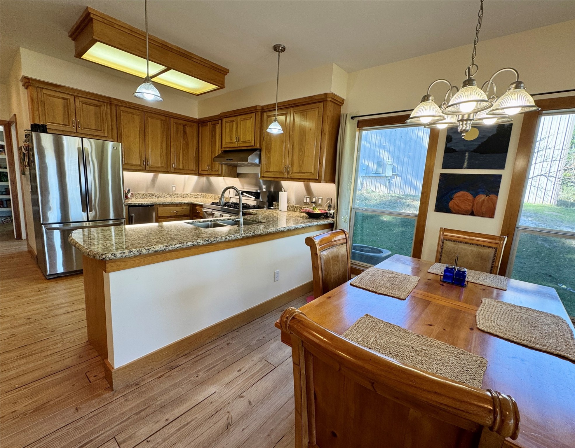 55 Lake Road Huntsville, TX 77320 - Photo 8 of 50 a kitchen with sink refrigerator and microwave