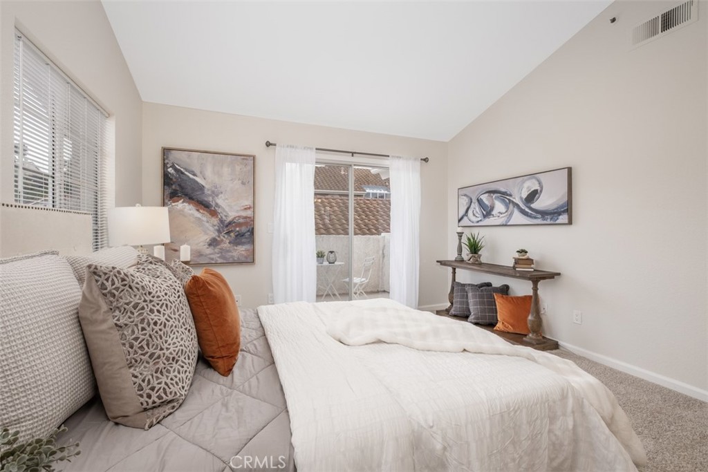 10 Finca San Clemente, CA 92672 - Photo 14 of 27 a bedroom with a bed couch and a window