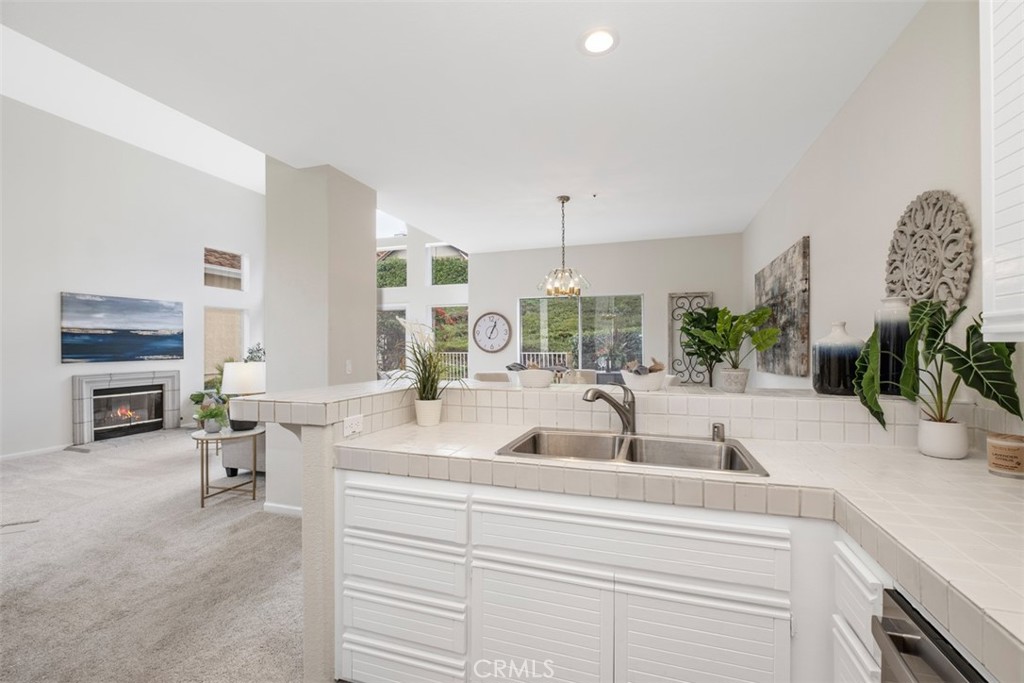 10 Finca San Clemente, CA 92672 - Photo 10 of 27 a view with a faucet a sink and a large mirror in a room