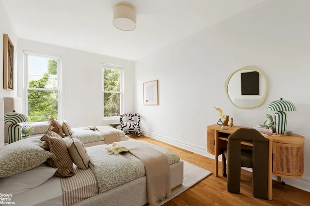 a bathroom with a double vanity sink a mirror and a shower