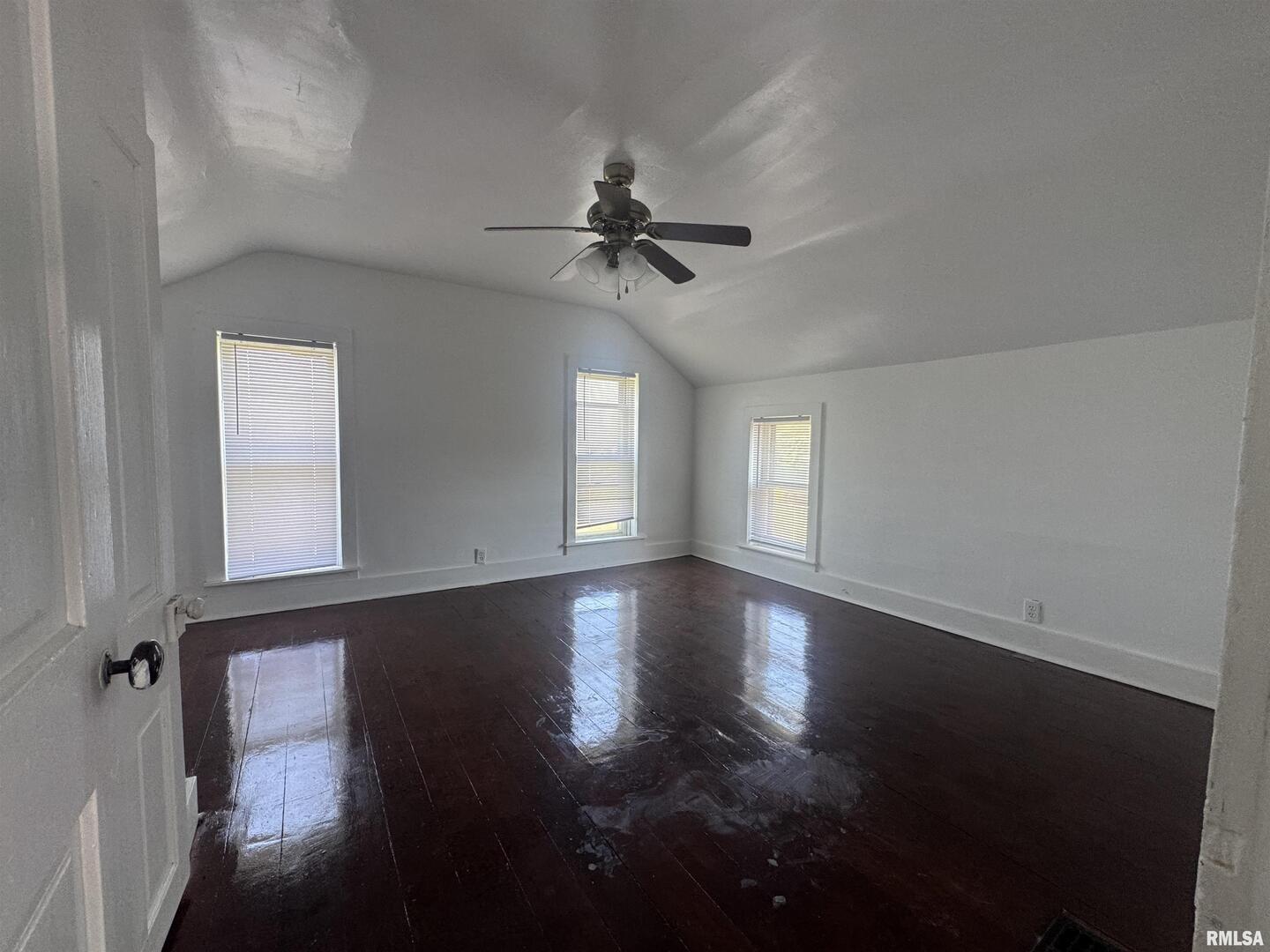 302 Coeburg Street Rio, IL 61472 - Photo 18 of 24 an empty room with wooden floor and windows