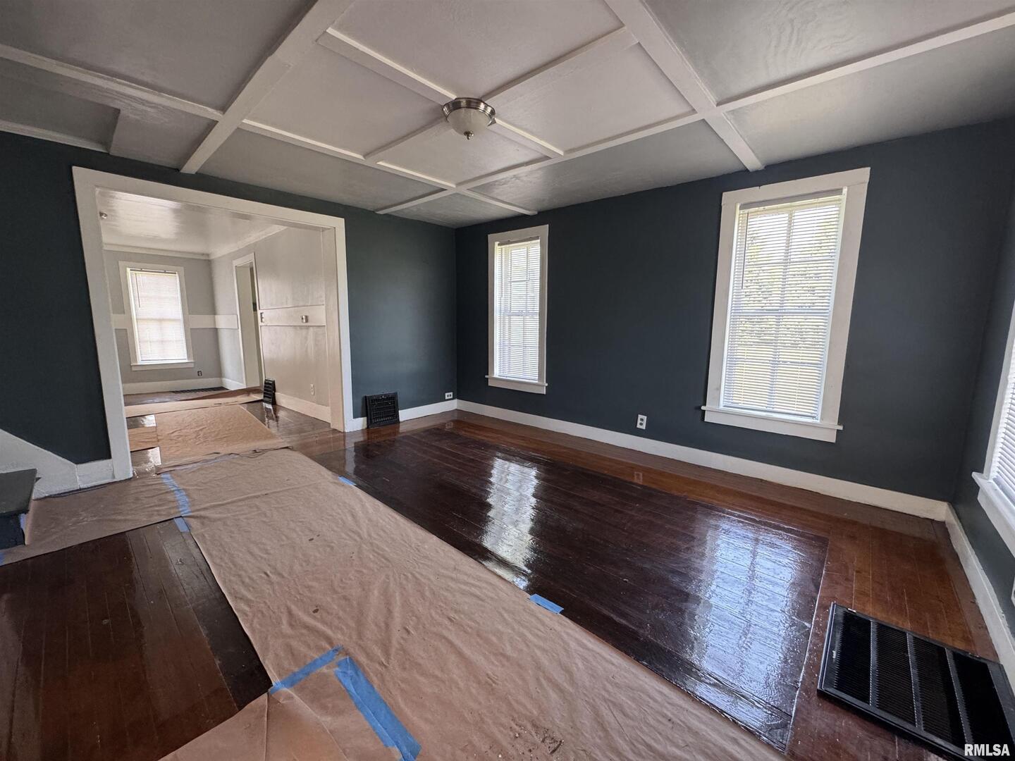 302 Coeburg Street Rio, IL 61472 - Photo 5 of 24 a view of an empty room with window and wooden floor