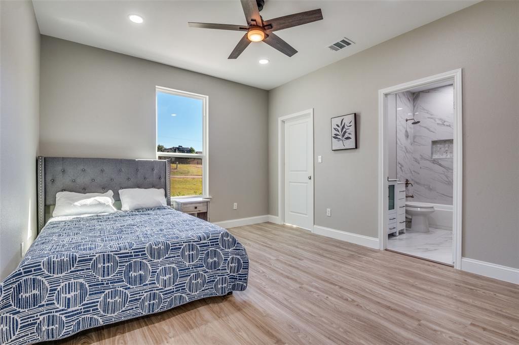 206 Splitrail Drive Mabank, TX 75143 - Photo 20 of 28 Bedroom with light wood-type flooring, recessed lighting, ceiling fan, and ensuite bath
