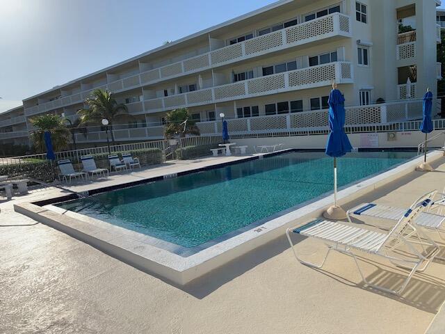 2565 South Ocean Boulevard, Unit 2060 Palm Beach, FL 33480 - Photo 5 of 17 a view of building with yard