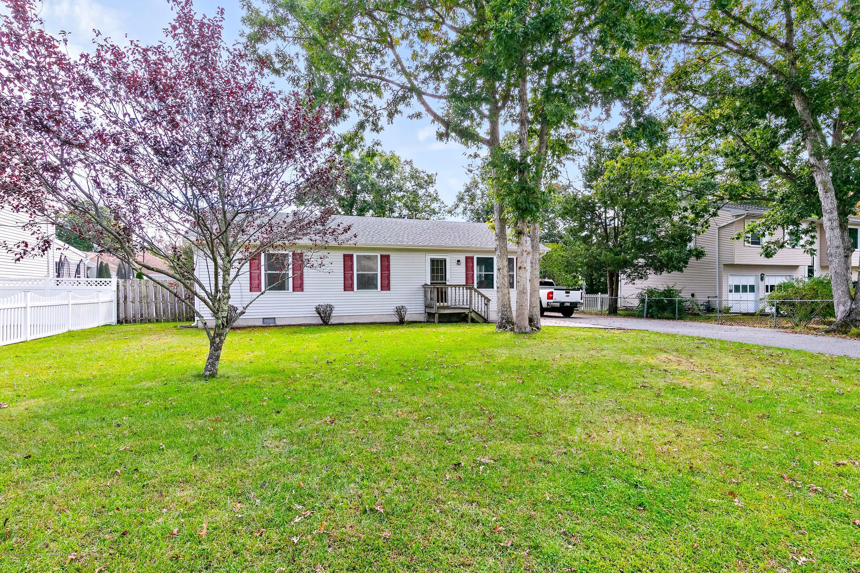 121 Wave Road Manahawkin, NJ 08050 - Photo 1 of 40 a house view with swimming pool and garden