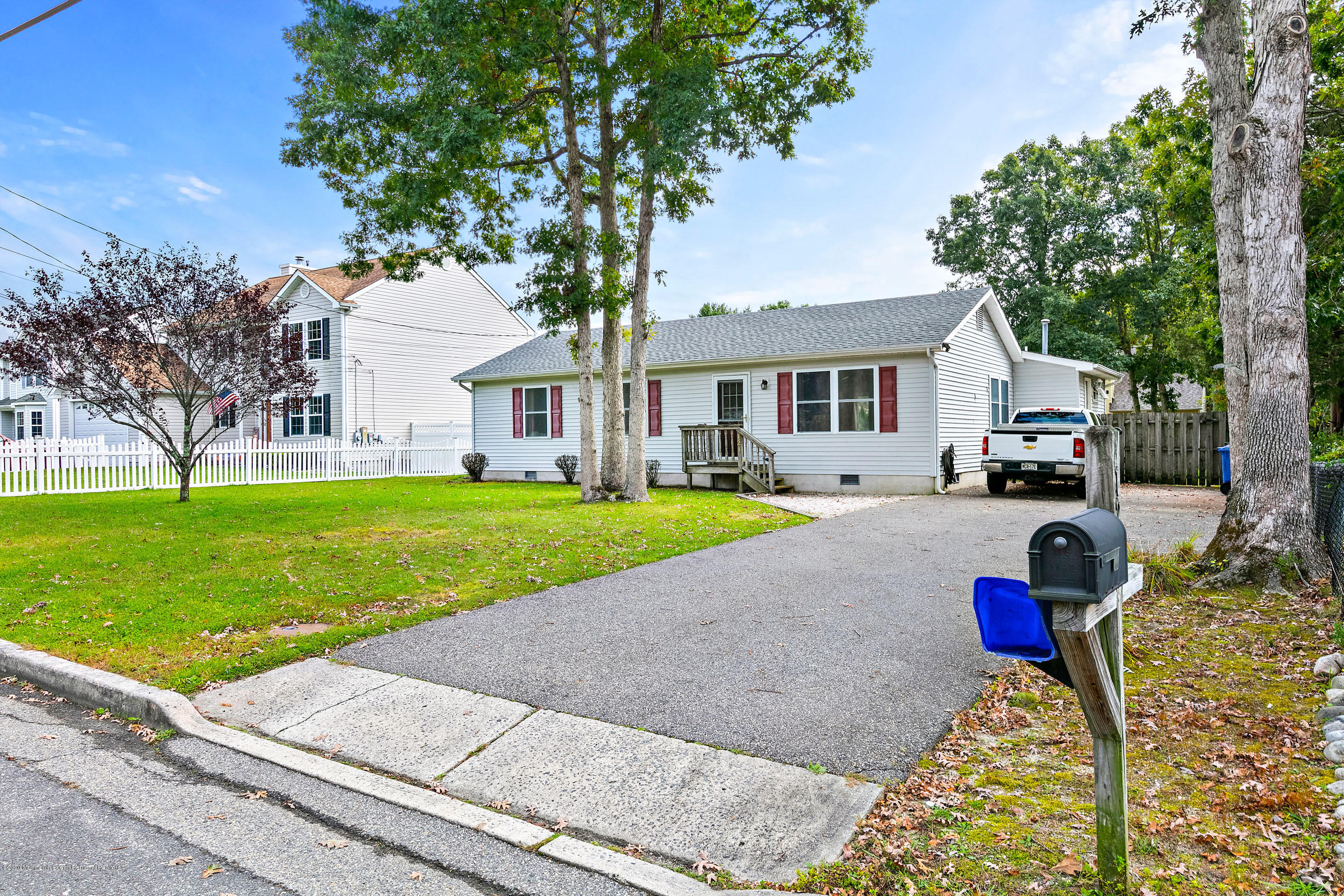 121 Wave Road Manahawkin, NJ 08050 - Photo 2 of 40 a view of a house with a yard and large tree