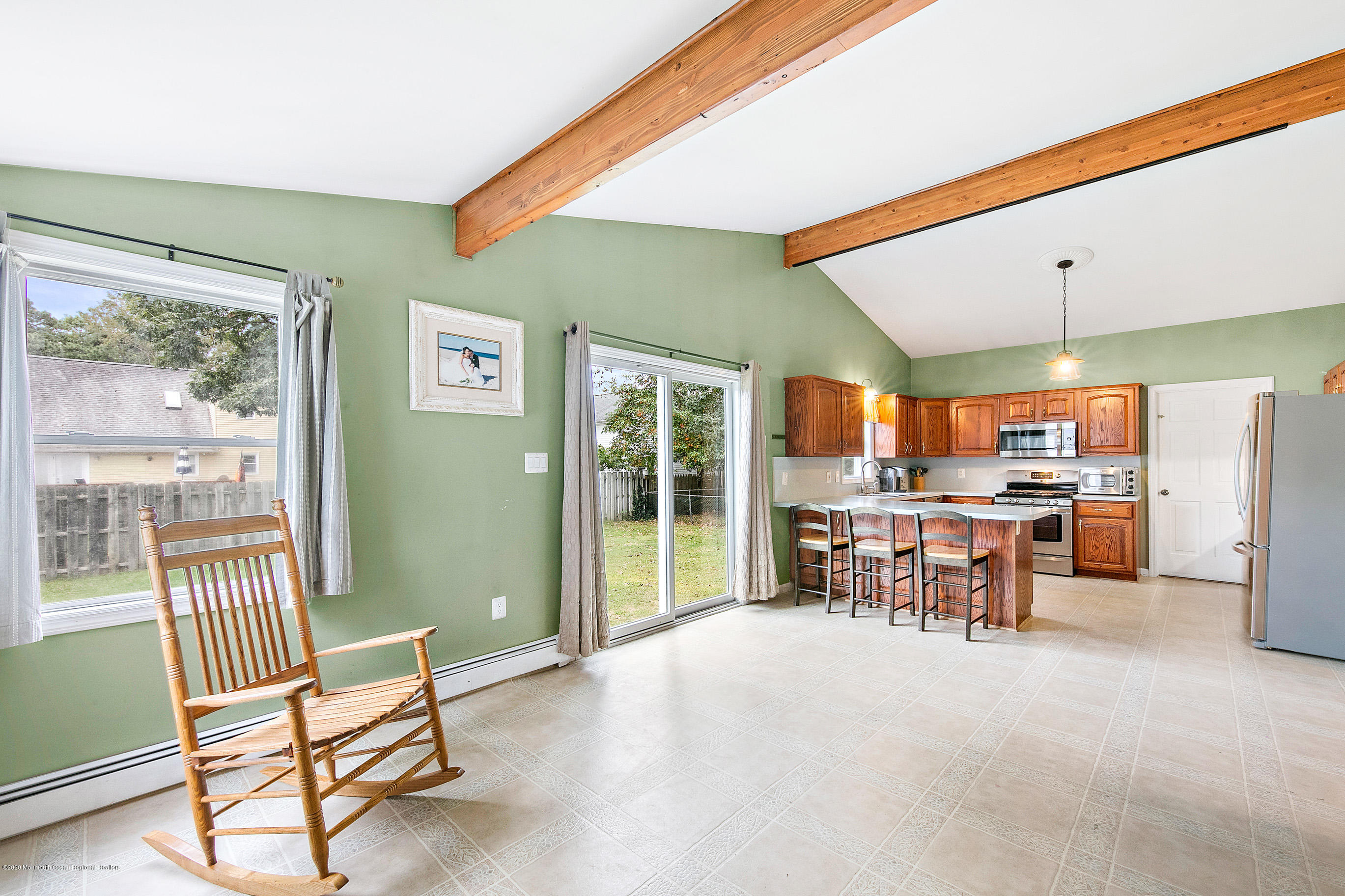 121 Wave Road Manahawkin, NJ 08050 - Photo 22 of 40 a view of a dining room with furniture window and outside view