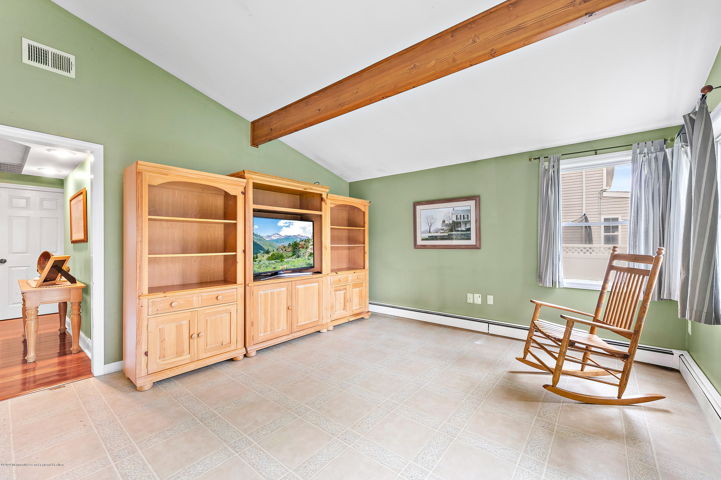 121 Wave Road Manahawkin, NJ 08050 - Photo 23 of 40 a view of a livingroom with furniture and staircase