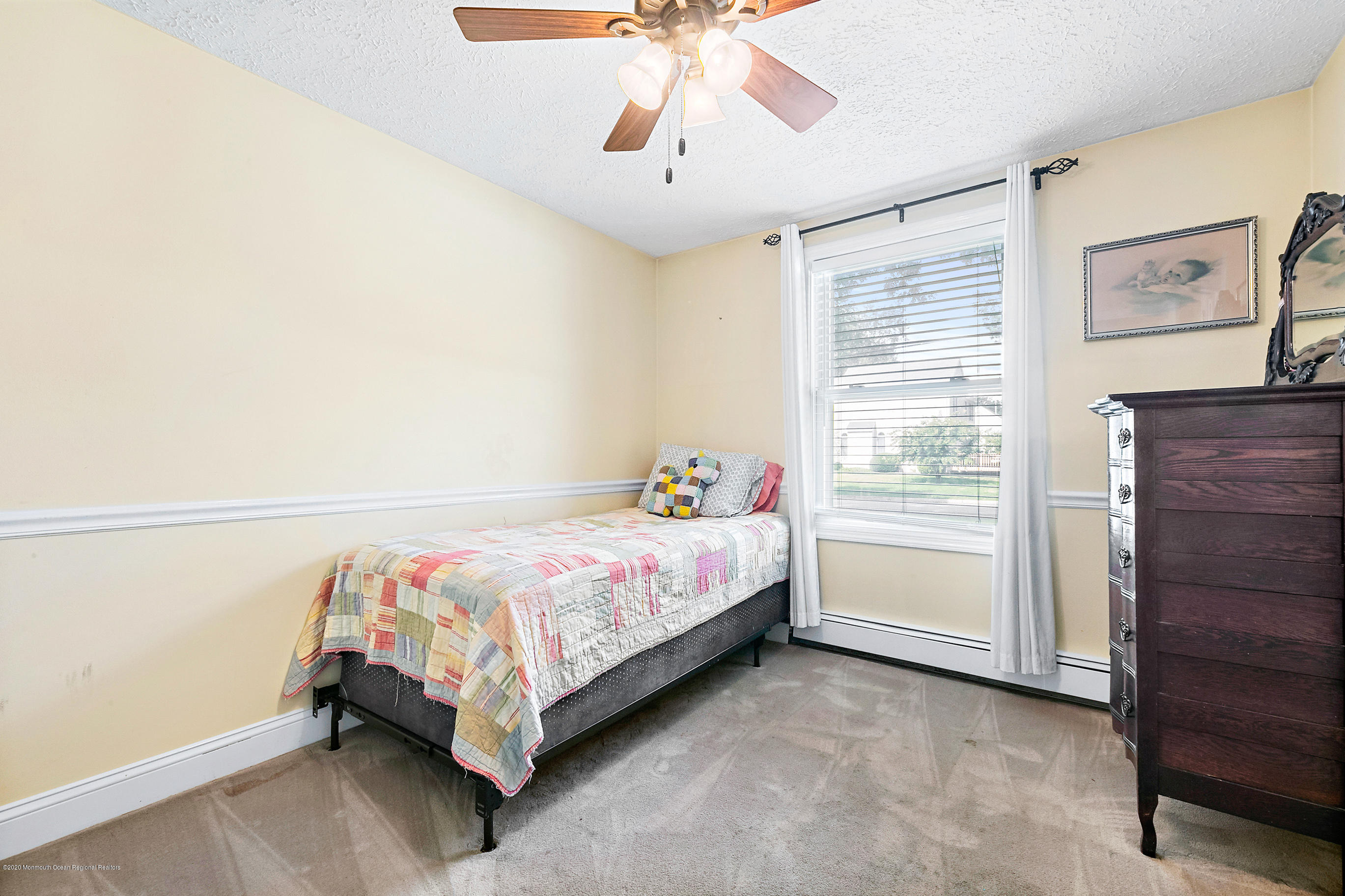 121 Wave Road Manahawkin, NJ 08050 - Photo 31 of 40 a bed room with a bed and a window