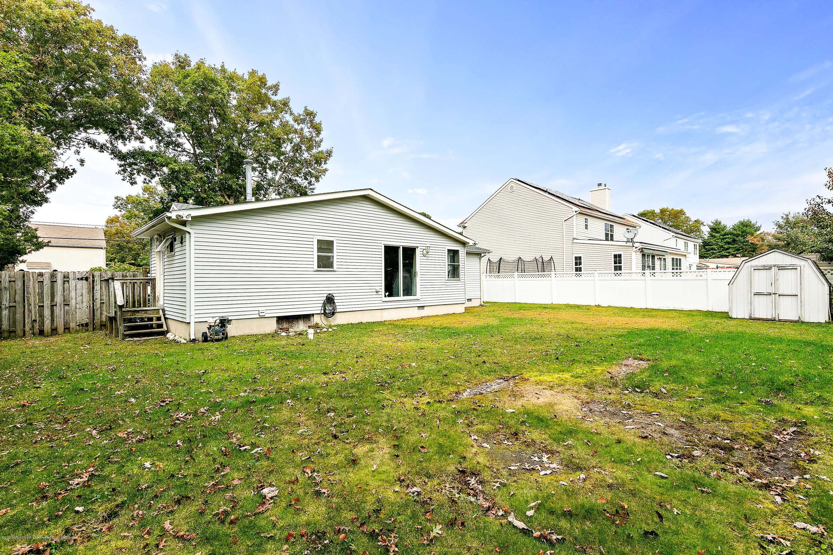 121 Wave Road Manahawkin, NJ 08050 - Photo 38 of 40 a view of a house with a yard