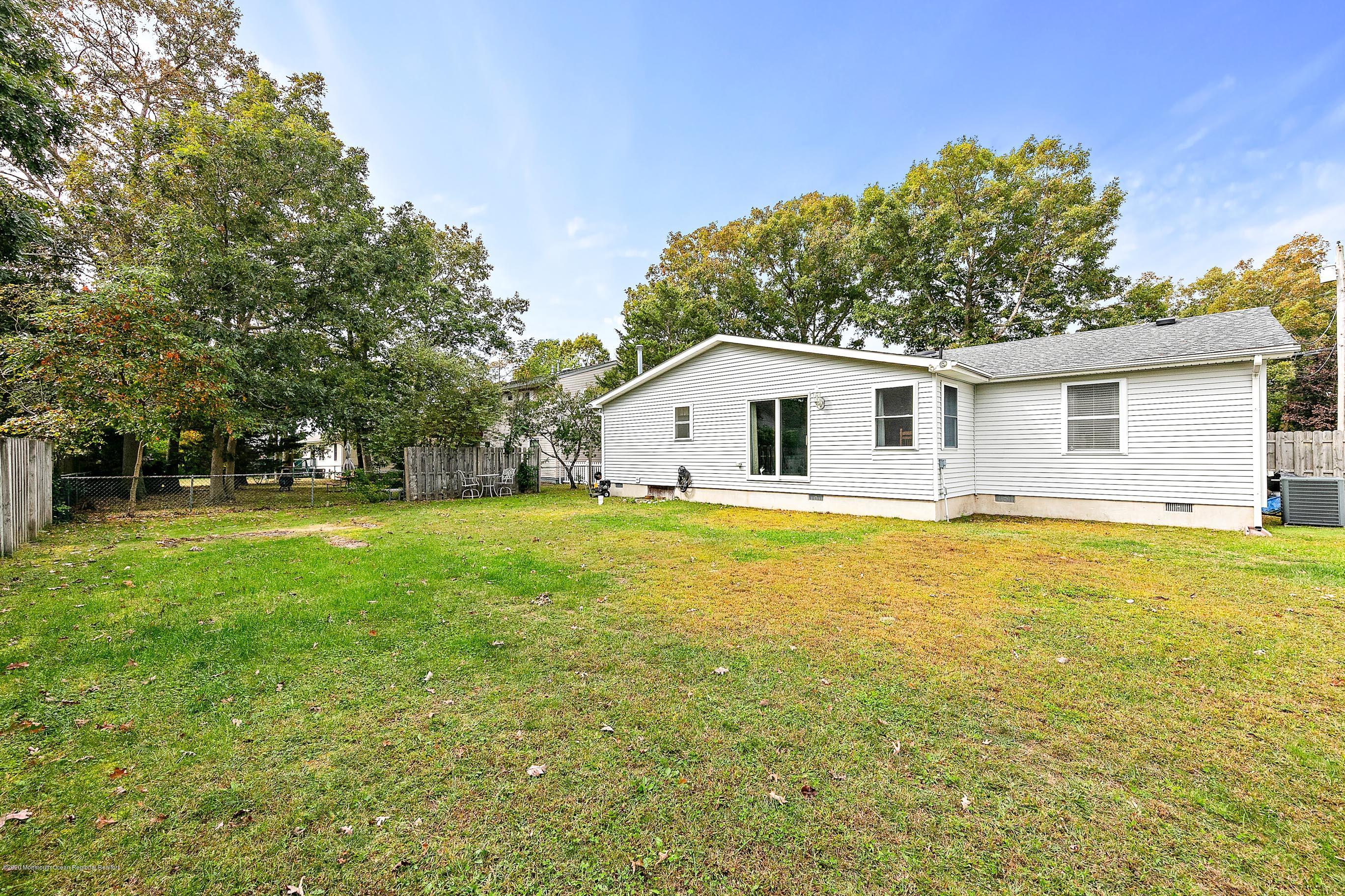 121 Wave Road Manahawkin, NJ 08050 - Photo 39 of 40 a house view with swimming pool in front of it