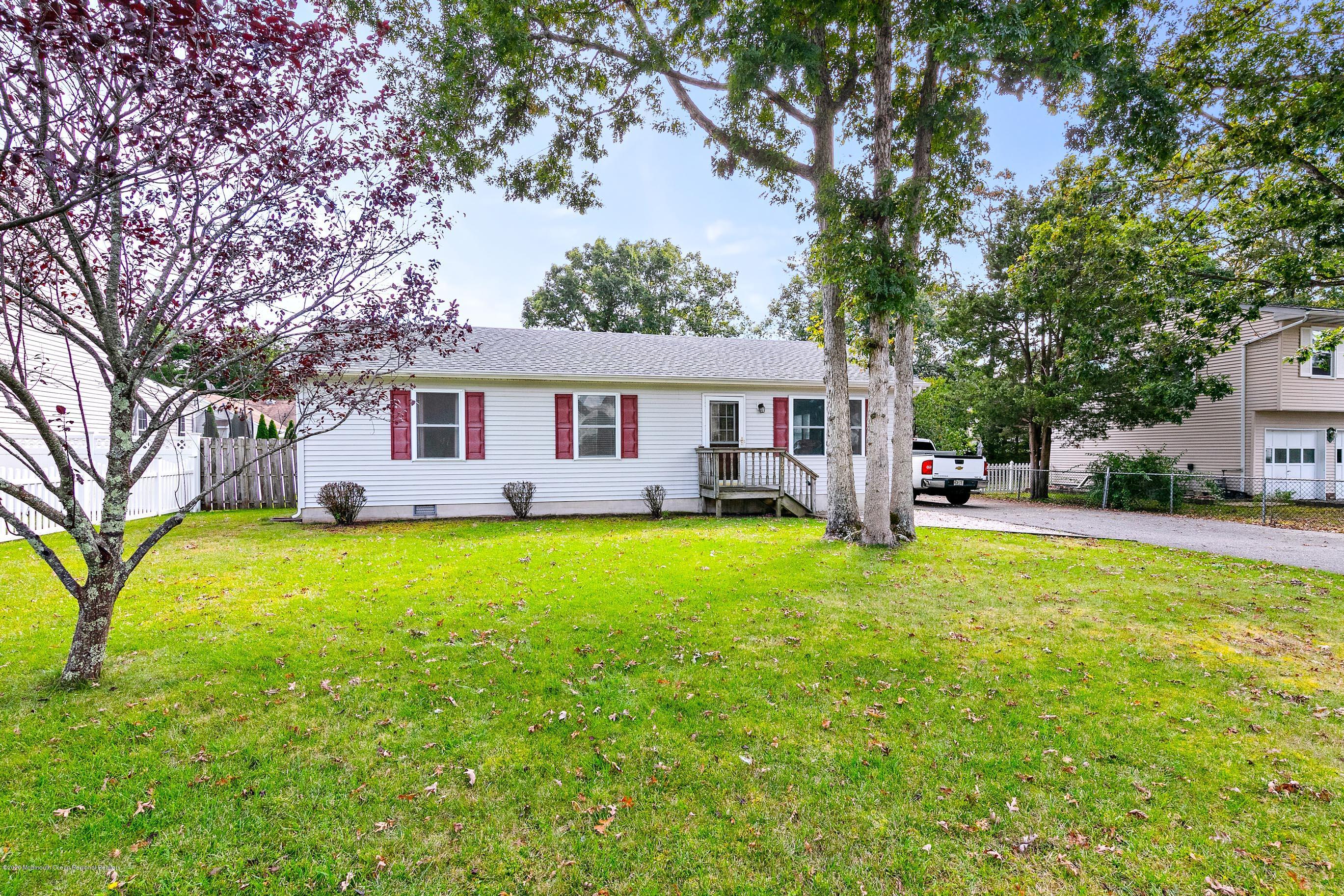 121 Wave Road Manahawkin, NJ 08050 - Photo 5 of 40 a outdoor view of a house with swimming pool and porch