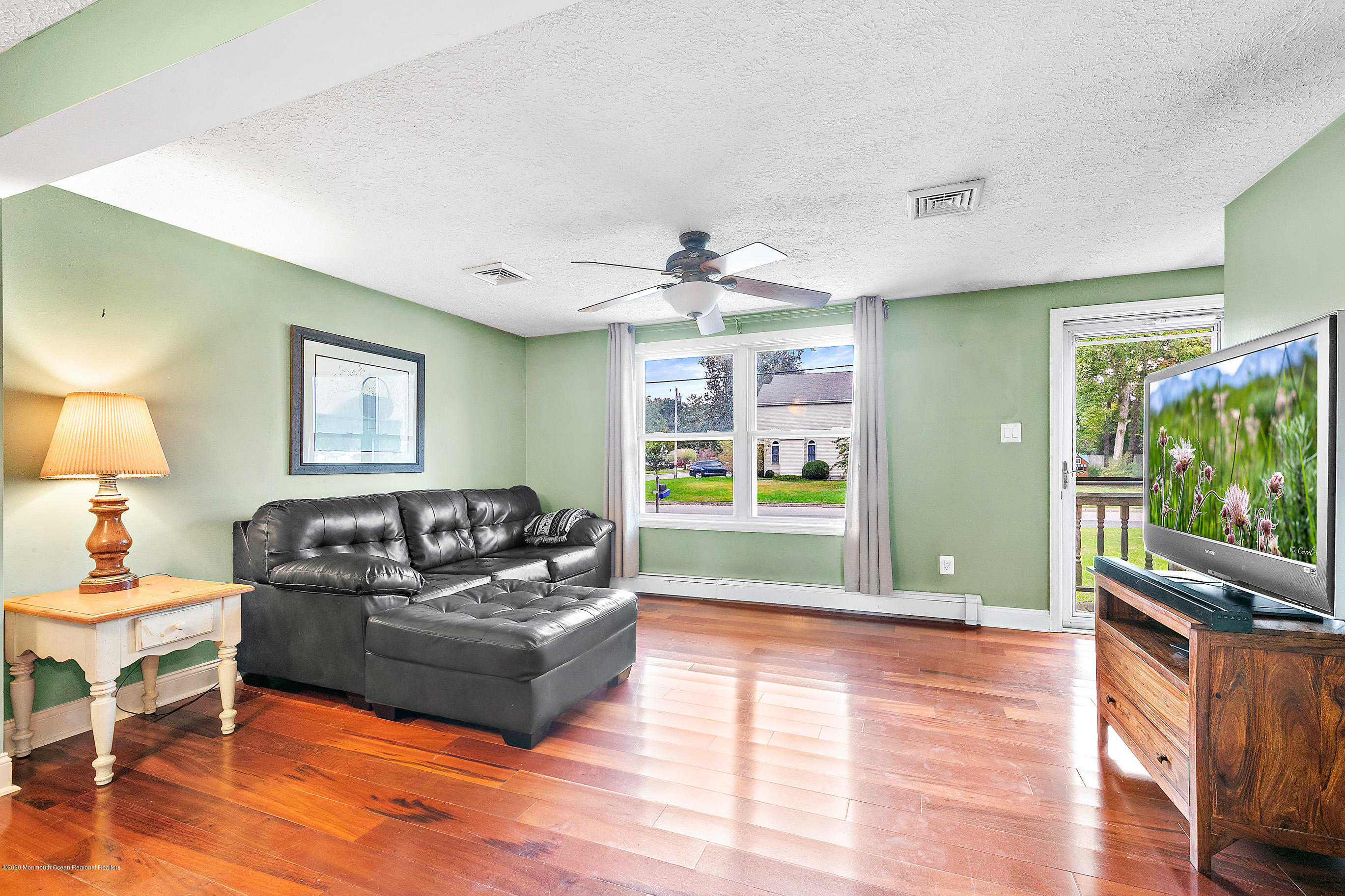 121 Wave Road Manahawkin, NJ 08050 - Photo 8 of 40 a living room with furniture and a wooden floor