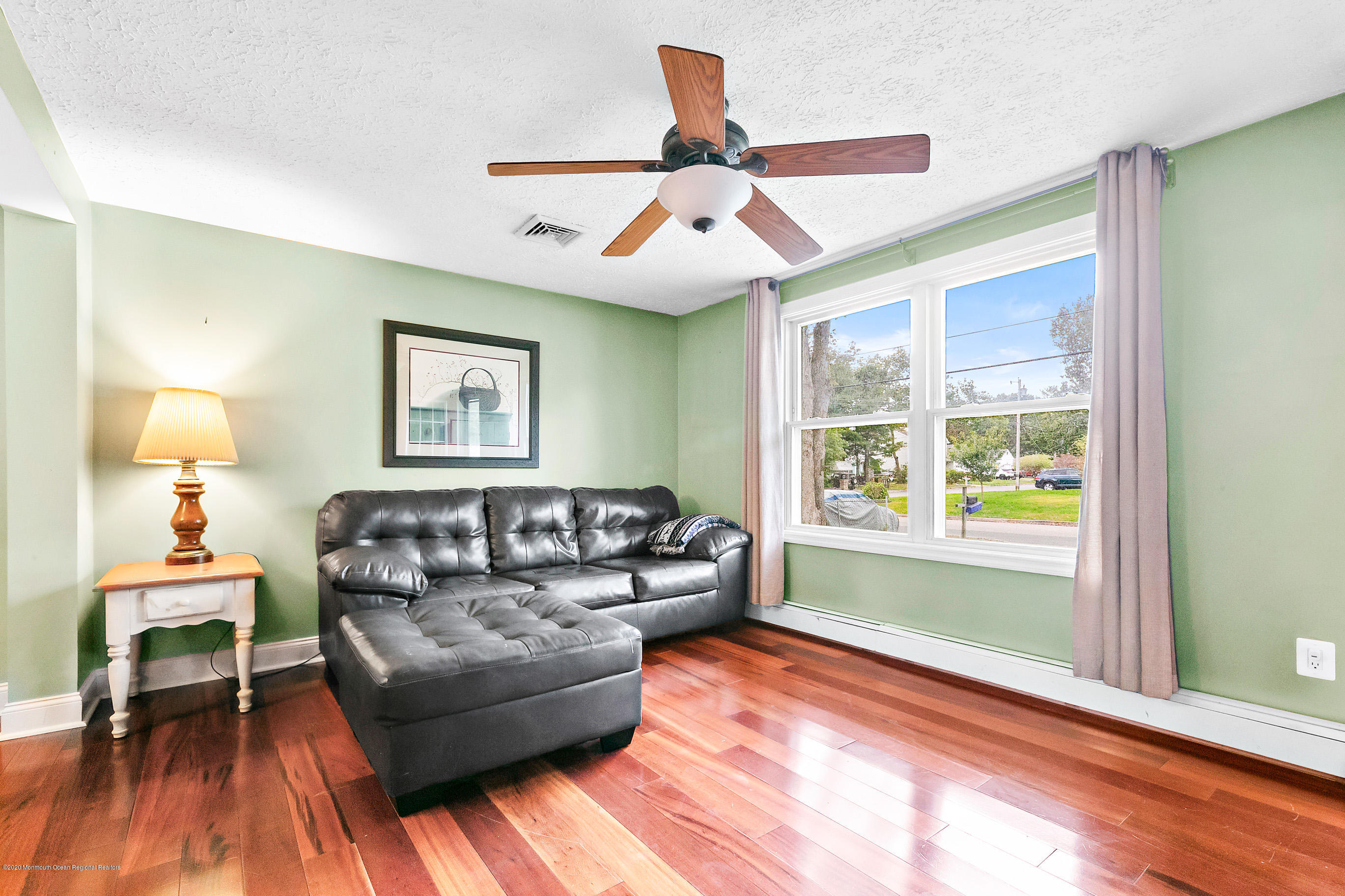 121 Wave Road Manahawkin, NJ 08050 - Photo 9 of 40 a living room with furniture and a window