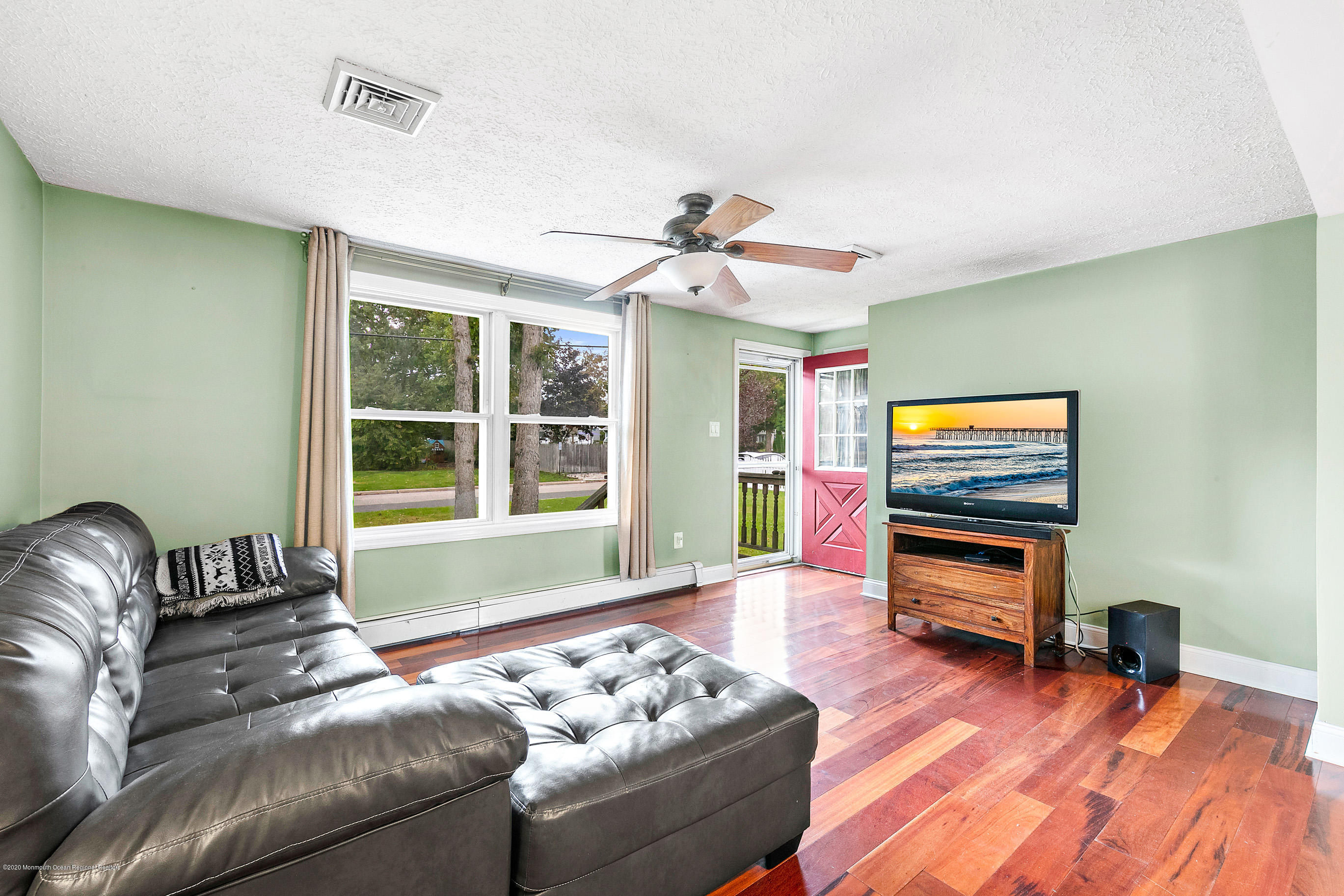 121 Wave Road Manahawkin, NJ 08050 - Photo 10 of 40 a living room with furniture and a window