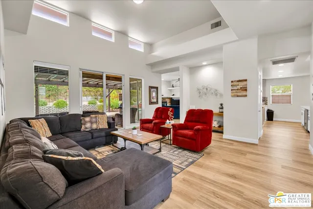 a living room with furniture and a large window