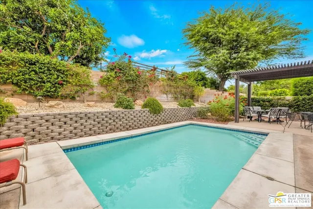 a view of a swimming pool with a patio