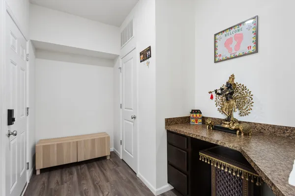 a bathroom with a granite countertop sink a vanity and a mirror