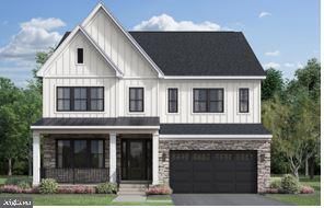 a front view of a house with yard and garage