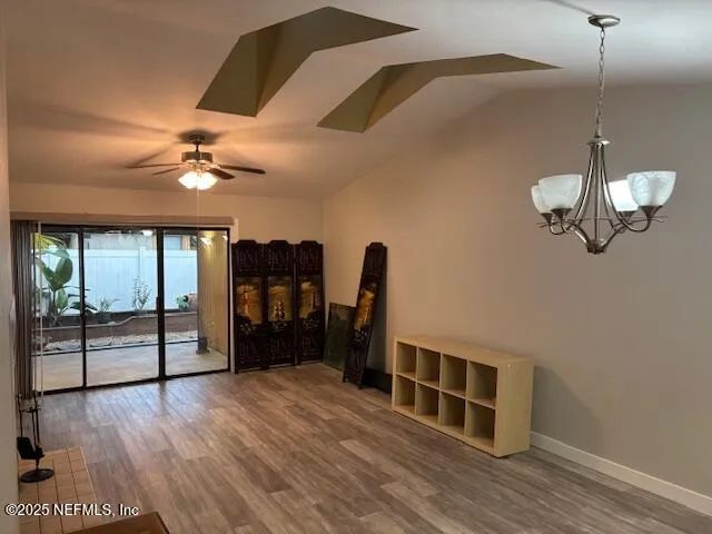 a view of a livingroom with furniture and wooden floor