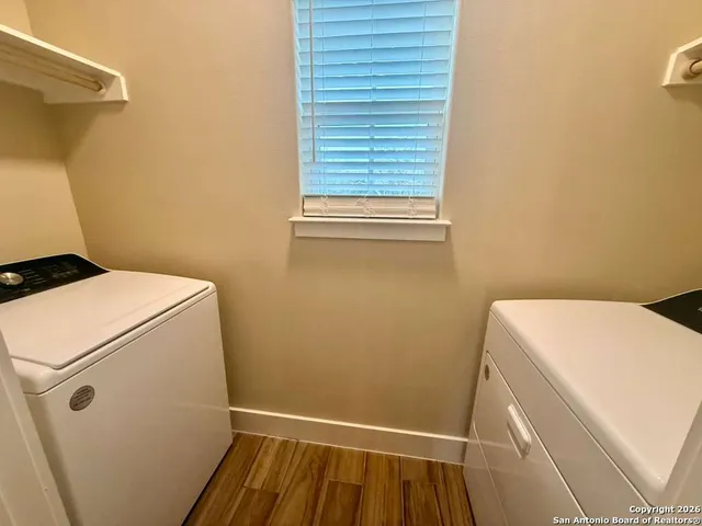 a view of house with backyard and tree