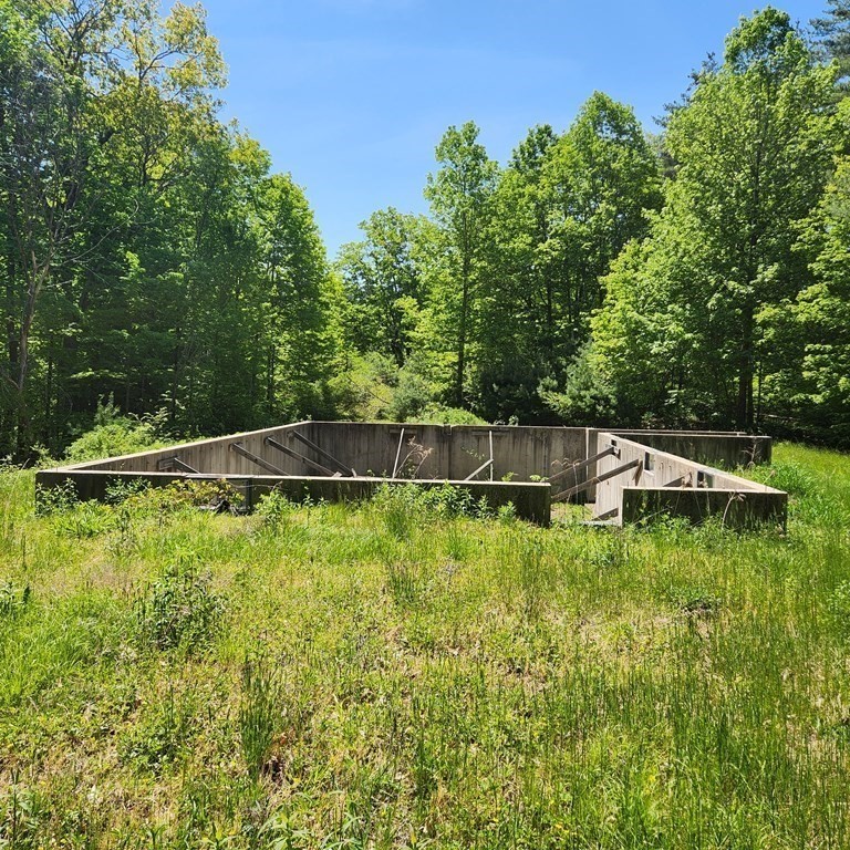 181 A South Road Pepperell, MA 01463 - Photo 10 of 13 a backyard with a small garden