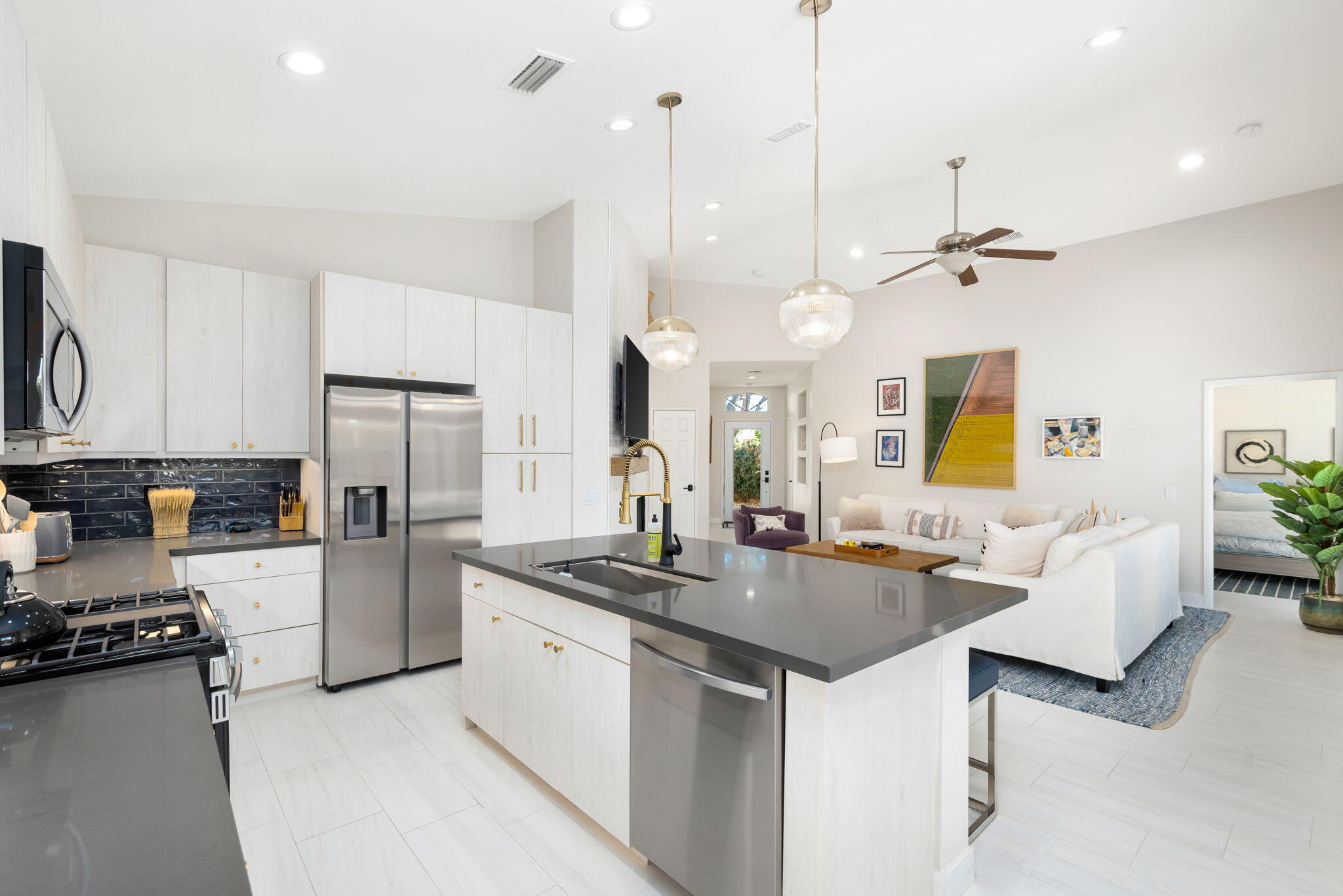 45809 Crosswater Street Indio, CA 92201 - Photo 22 of 48 a kitchen with refrigerator a stove and a sink