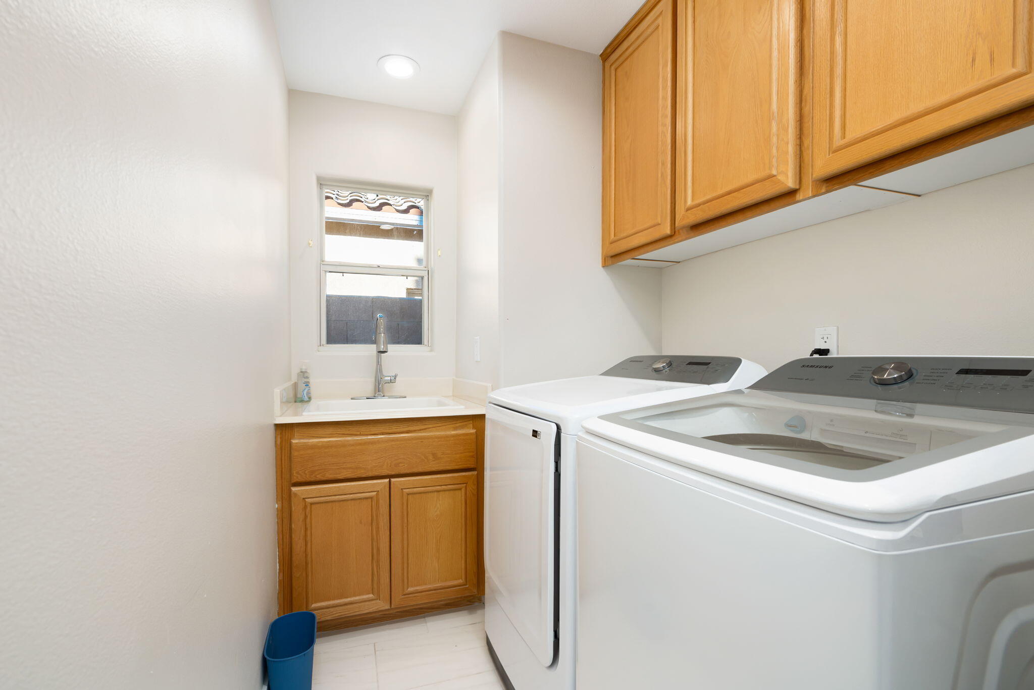 45809 Crosswater Street Indio, CA 92201 - Photo 48 of 48 a utility room with sink dryer and washer