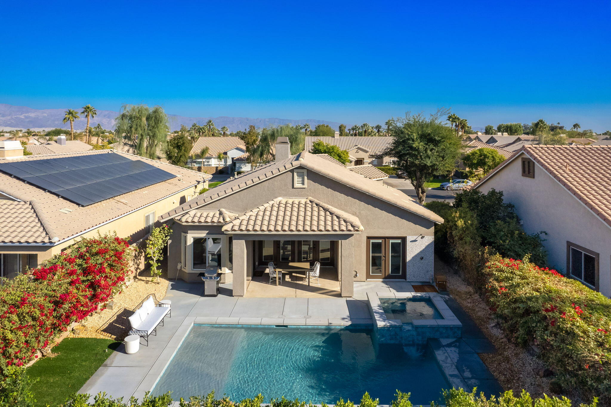 45809 Crosswater Street Indio, CA 92201 - Photo 5 of 48 a front view of a house with a yard