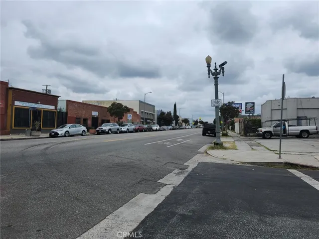 a view of a street with a building on the side