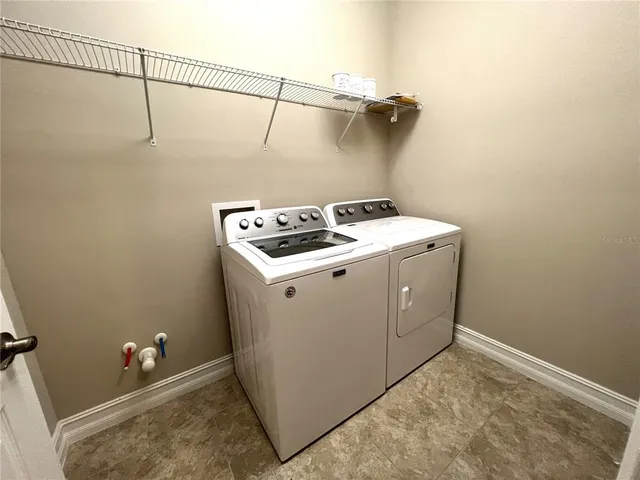 a view of outdoor space with wooden floor and windows