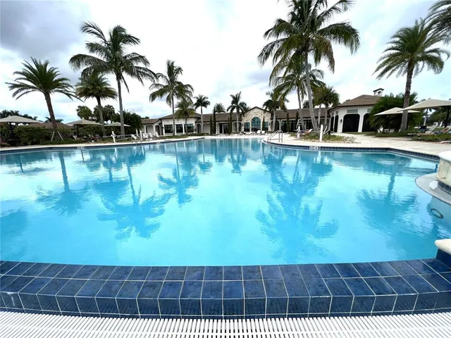 a front view of a building with a yard