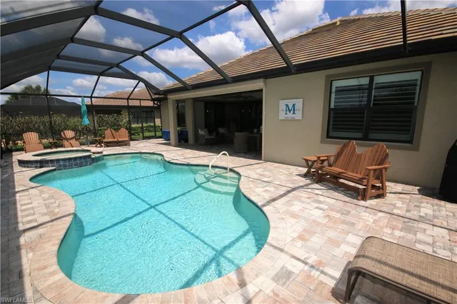 a view of a swimming pool with a patio