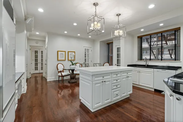a kitchen with stainless steel appliances granite countertop a stove and a refrigerator