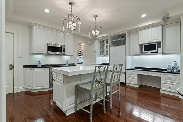a living room with furniture a dining table and chairs