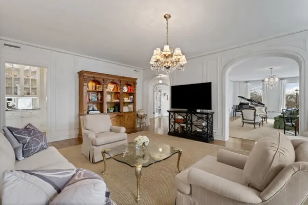 view of a hallway with seating area