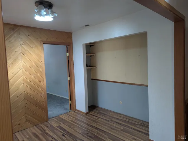 a view of a livingroom with wooden floor
