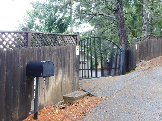 a street view from a wooden fence