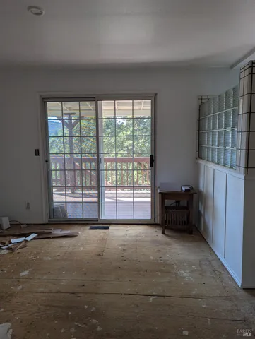 a view of an empty room with a window