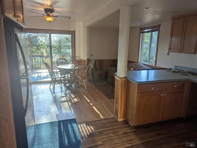 a kitchen with granite countertop a stove and a refrigerator
