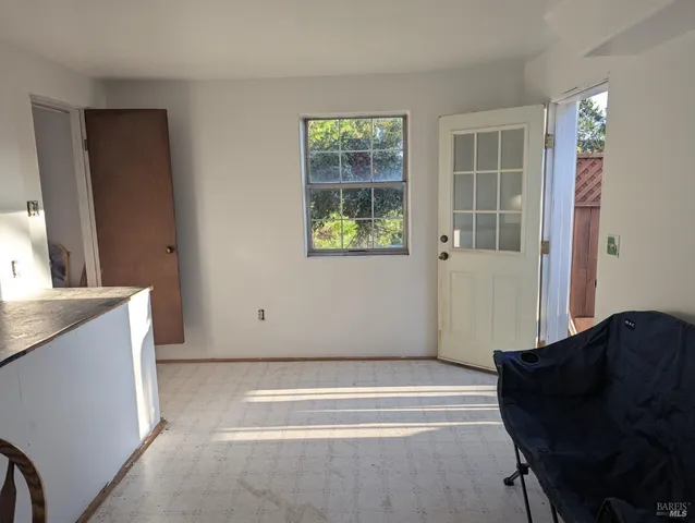 a view of a pathway of a house with a yard