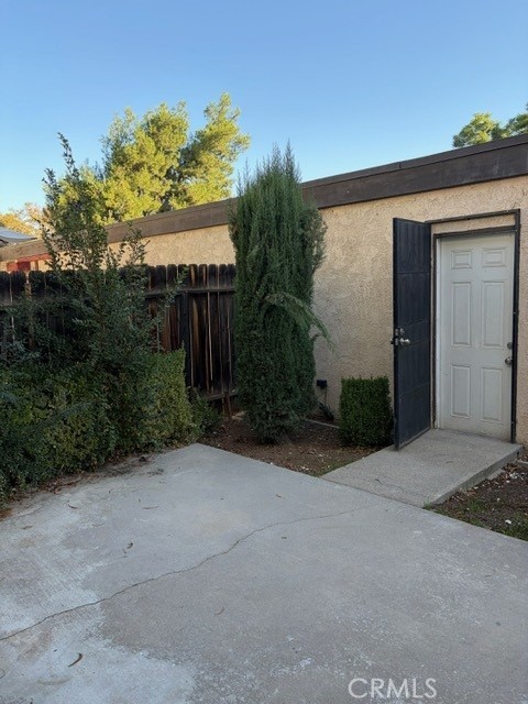 2822 Monroe Street Riverside, CA 92504 - Photo 7 of 13 a view of a house with a yard and potted plants