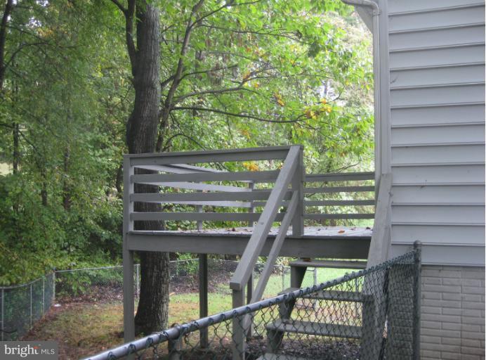 1744 Brookshire Run Point of Rocks, MD 21777 - Photo 4 of 15 a view of a porch with furniture and wooden deck